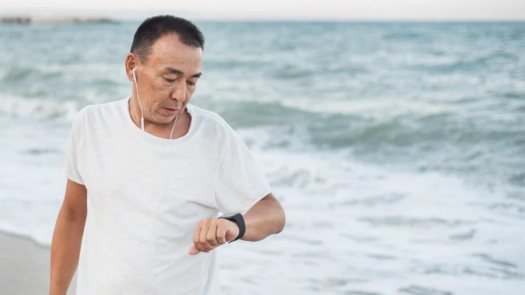 man by the sea in an anal weather watch waterproof atm min ATM در ساعت های مچی چیست و چگونه میزان مقاومت در برابر آب را تعیین میکند؟ ATM در ساعت های مچی چیست و چگونه میزان مقاومت در برابر آب را تعیین میکند؟